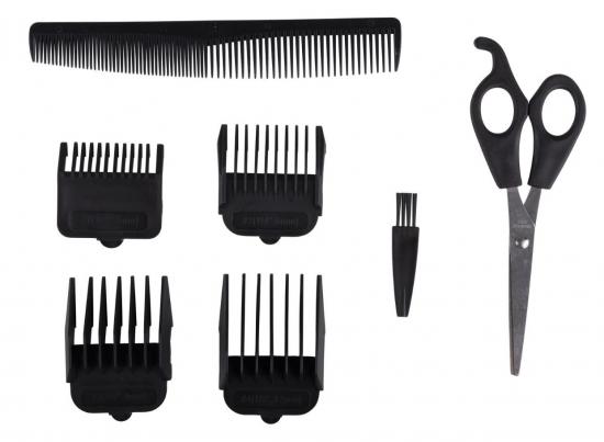 Ein Haarschneide-Set bestehend aus einer Schere, mehreren Aufsätzen und einem Kamm