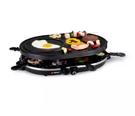 Elektrischer Raclette-Grill mit Grillplatte, Pfännchen und Speisen wie Ei, Gemüse und Fleisch